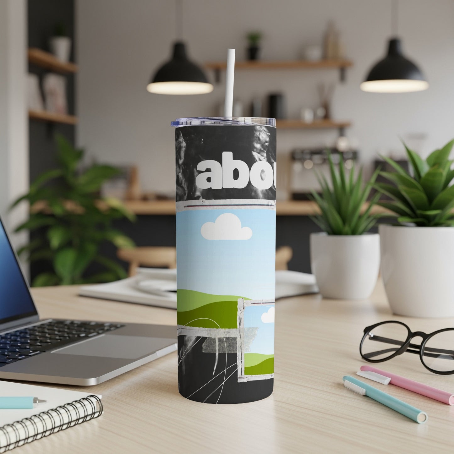 Black tumbler with "aboi" text and scenic collage design.