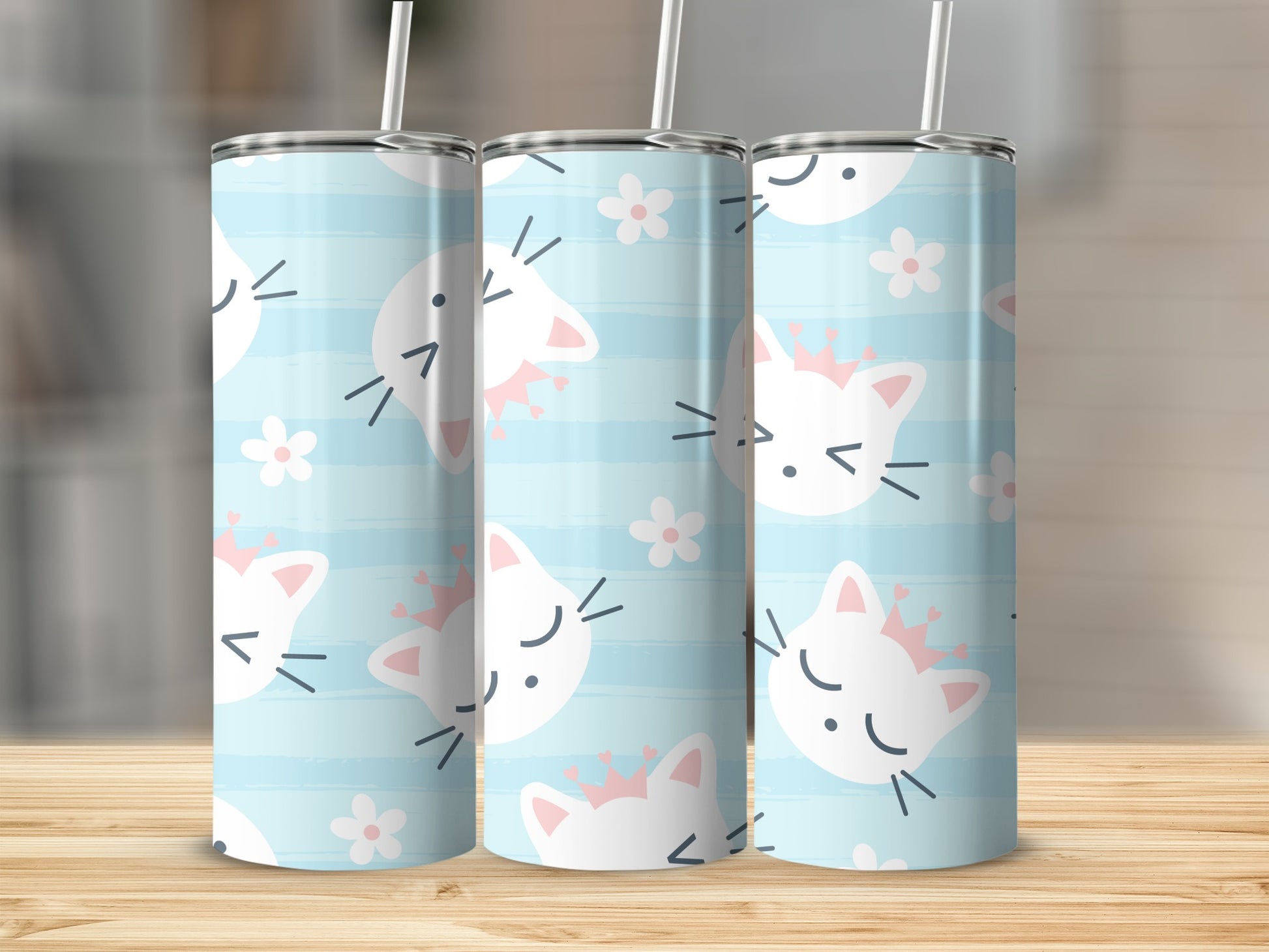 Three tumblers with a blue striped background featuring white cats wearing pink crowns and flowers.