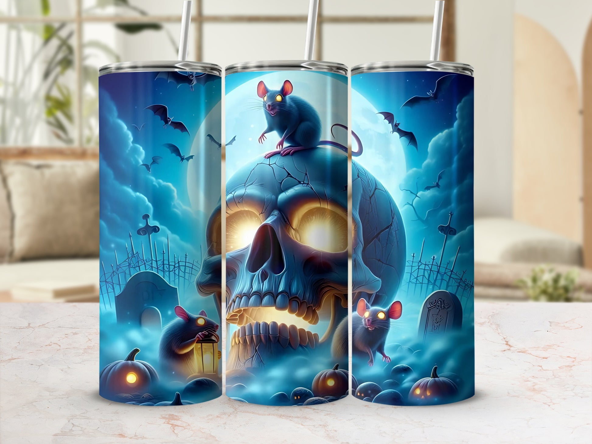 Three tumblers with Halloween-themed art featuring a skull, mice, bats, pumpkins, and tombstones.