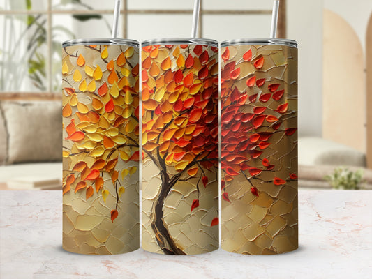Three tumblers with textured autumnal tree art on a marbled surface.