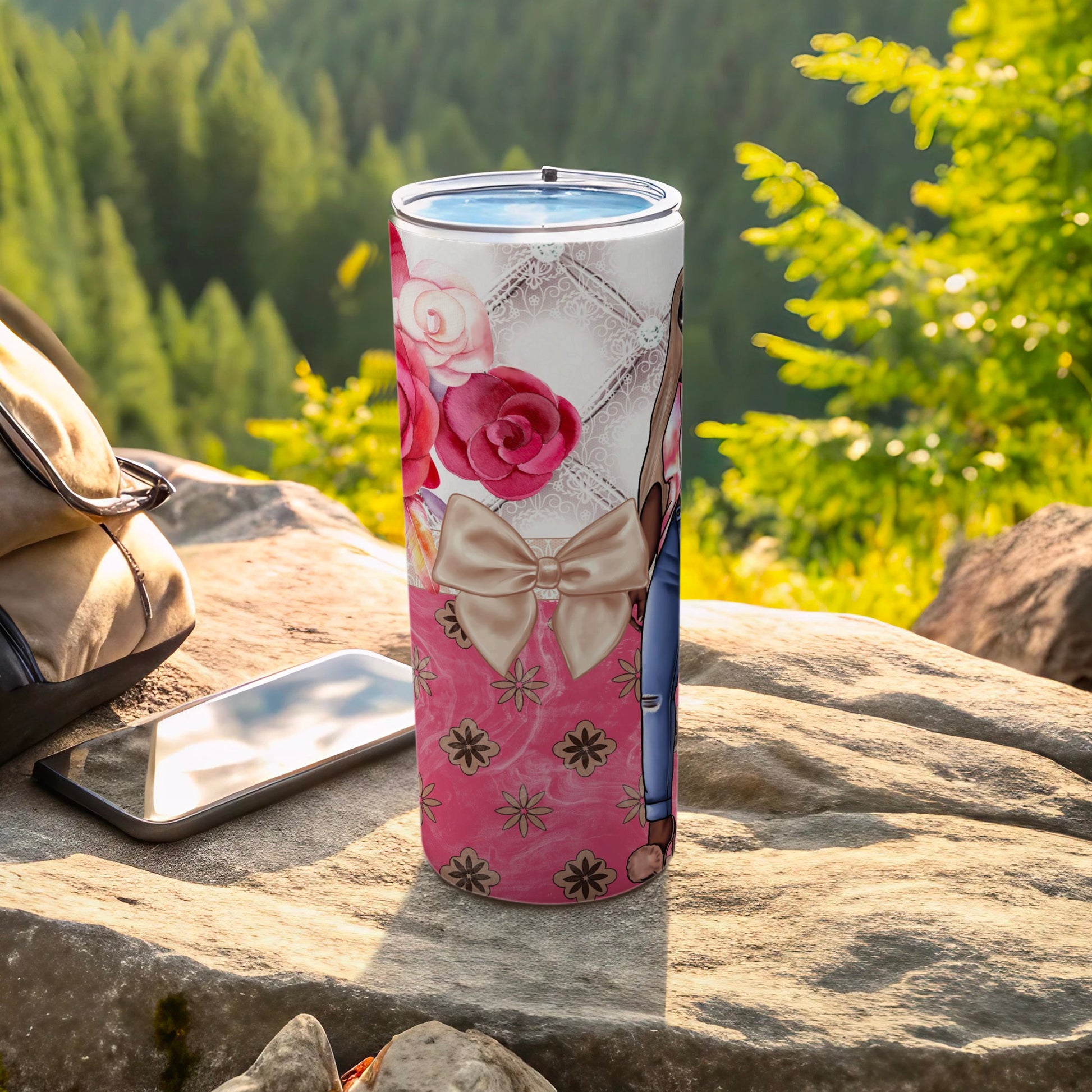 Pink floral tumbler with bow and denim overalls design.