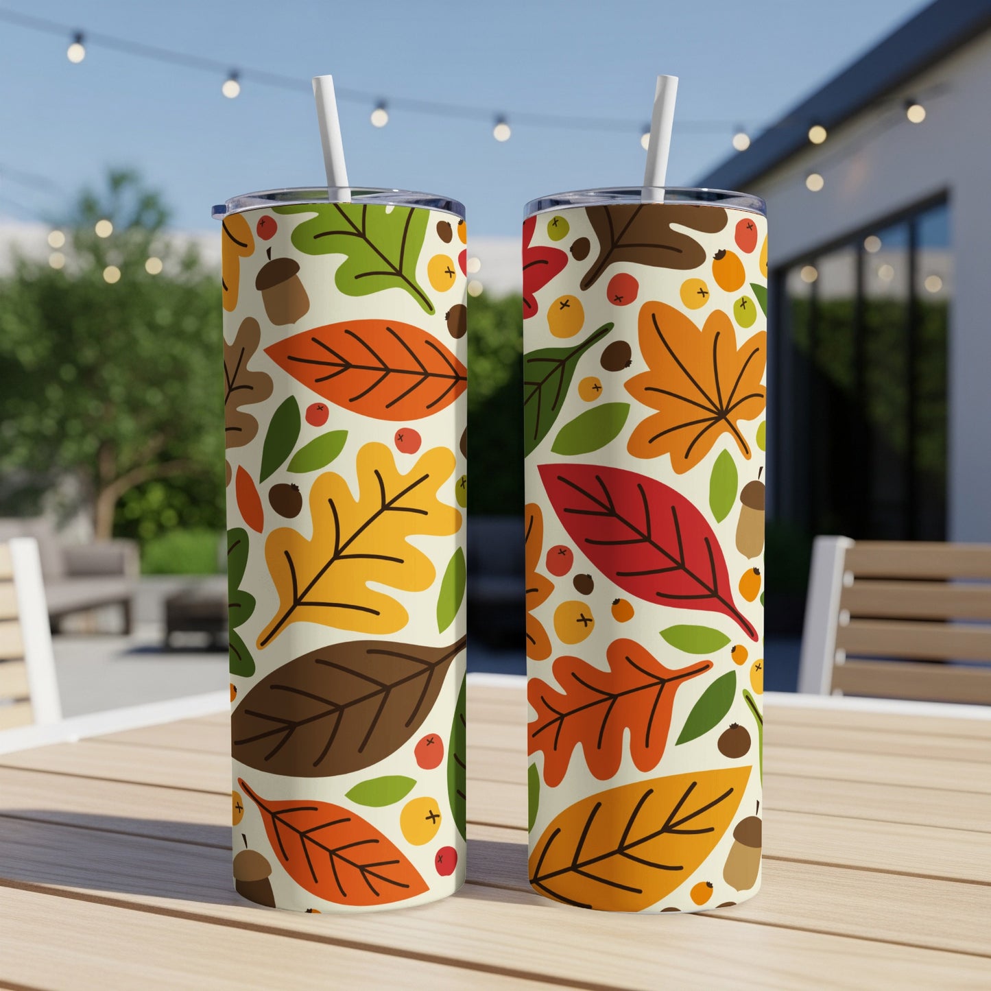 Two tumblers with a colorful autumn leaf and acorn pattern.