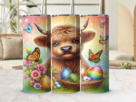 Highland cow with Easter eggs and butterflies on a tumbler.