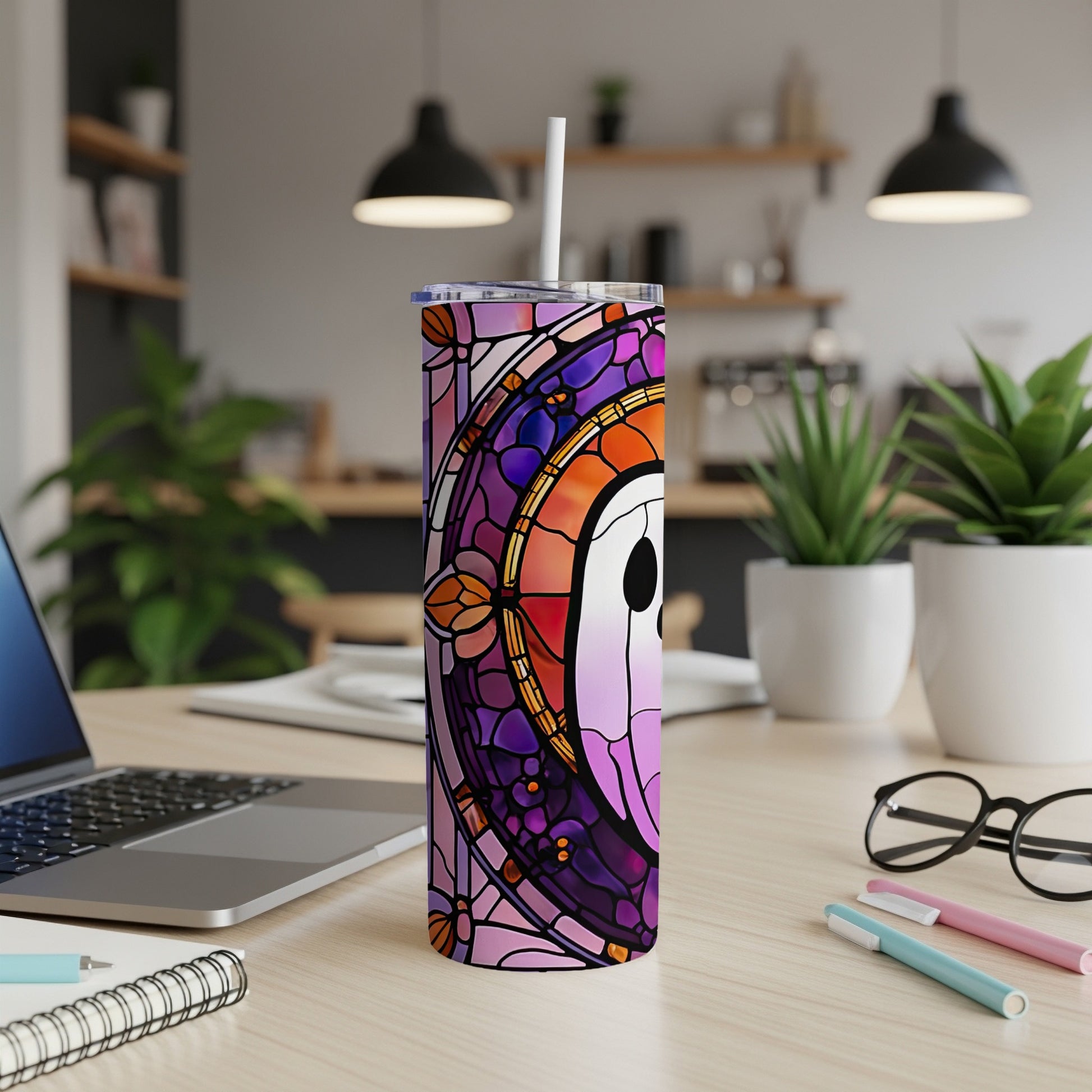 Tumbler with stained glass design featuring purple, pink, and orange hues.