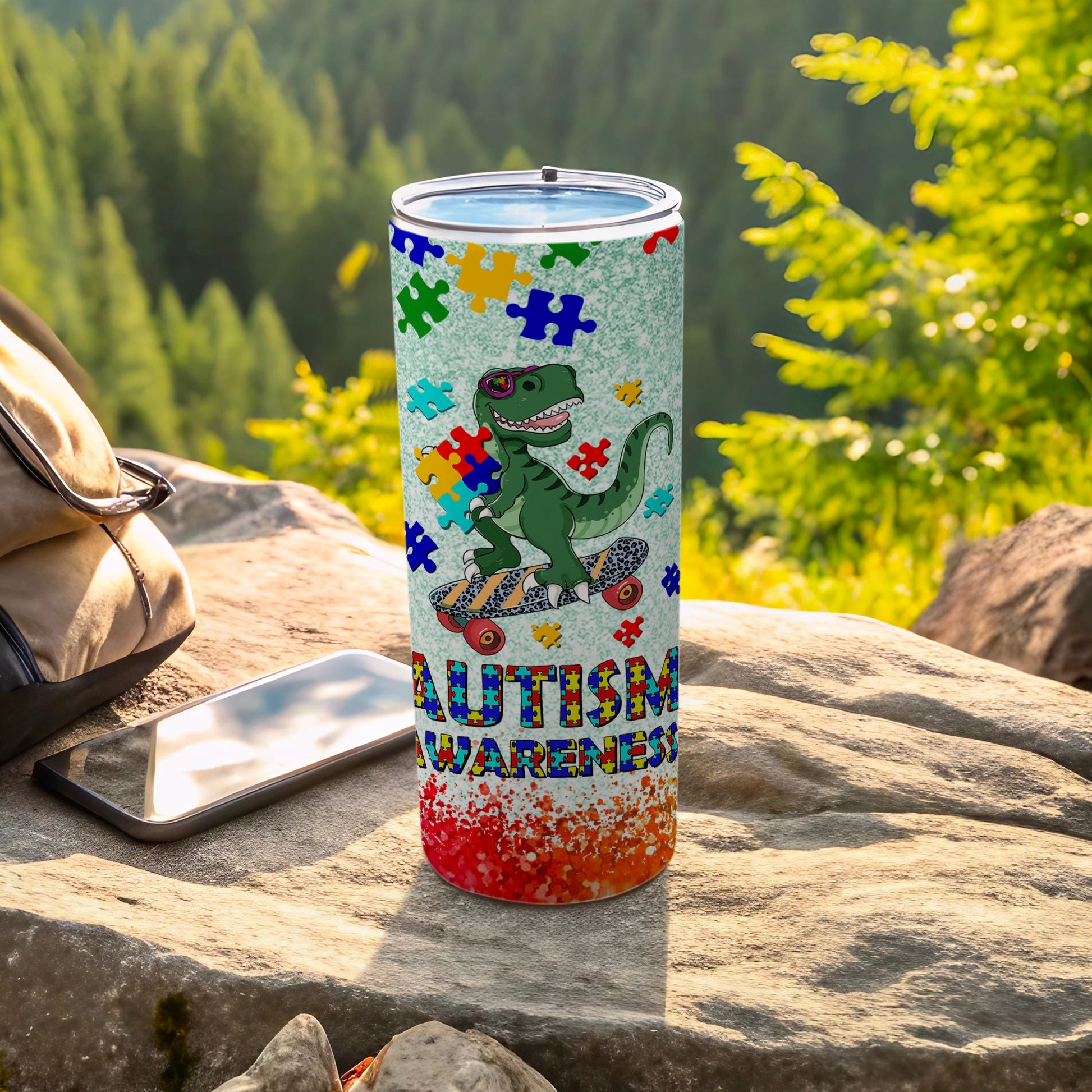 Autism awareness tumbler with colorful puzzle pieces, a skateboarding dinosaur, and textured background.