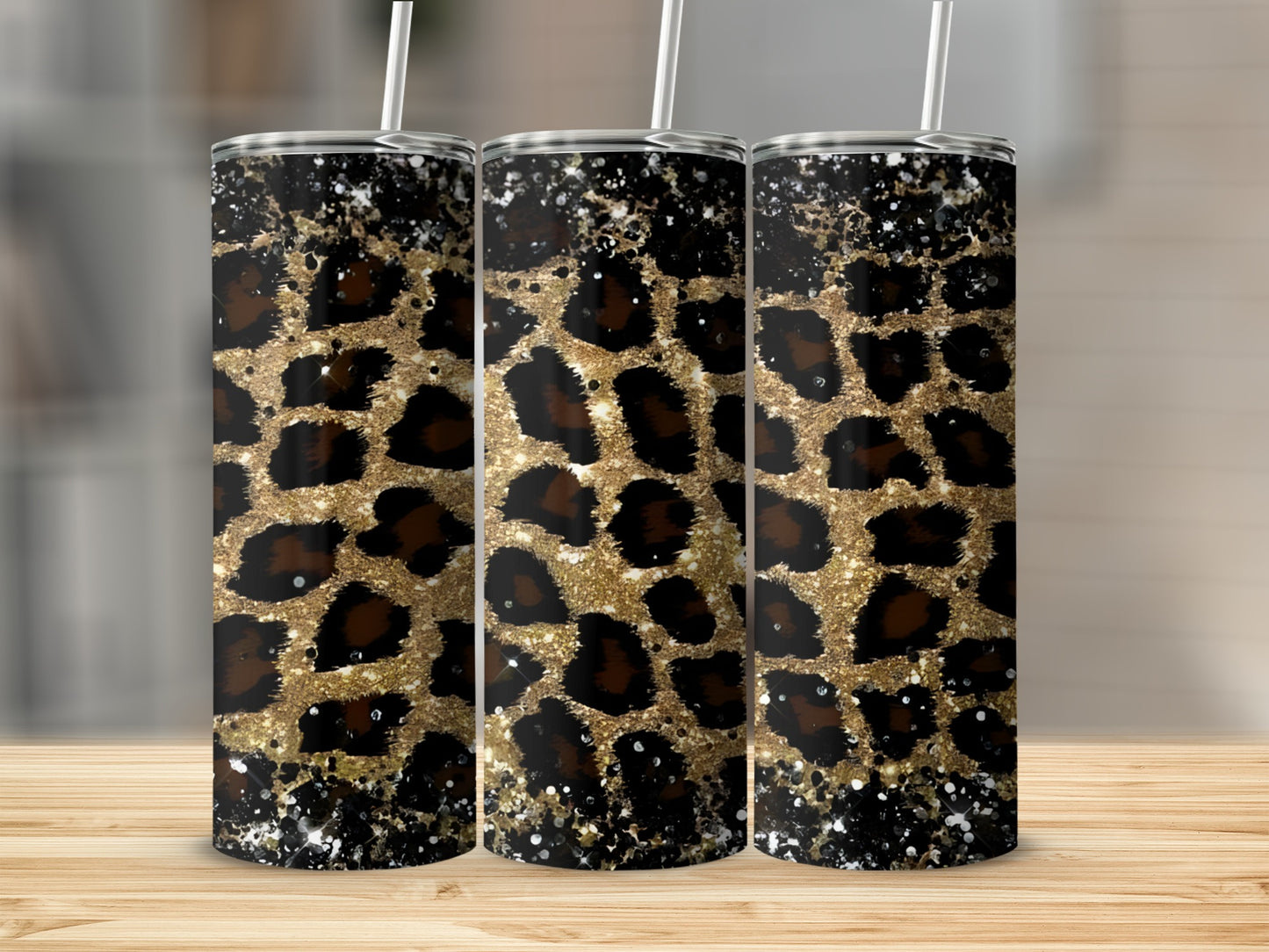 Three tumblers with gold and black leopard print and glitter accents.