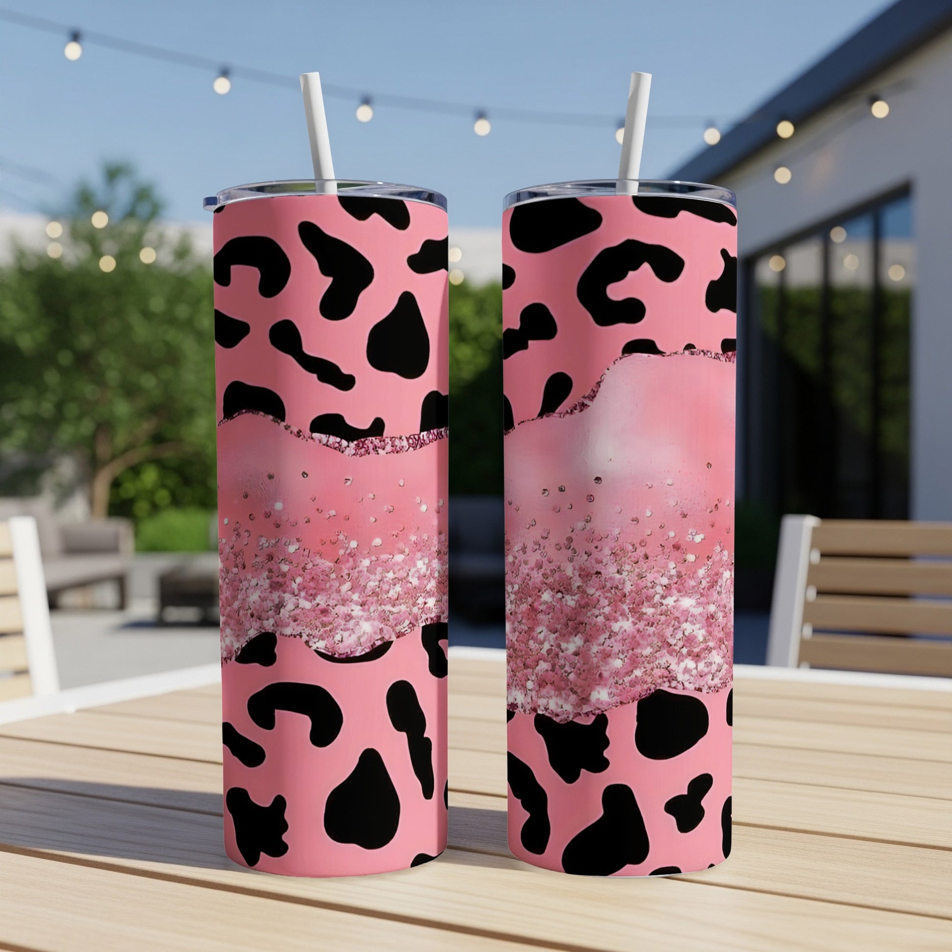 Two pink tumblers with black leopard print and glitter accents.