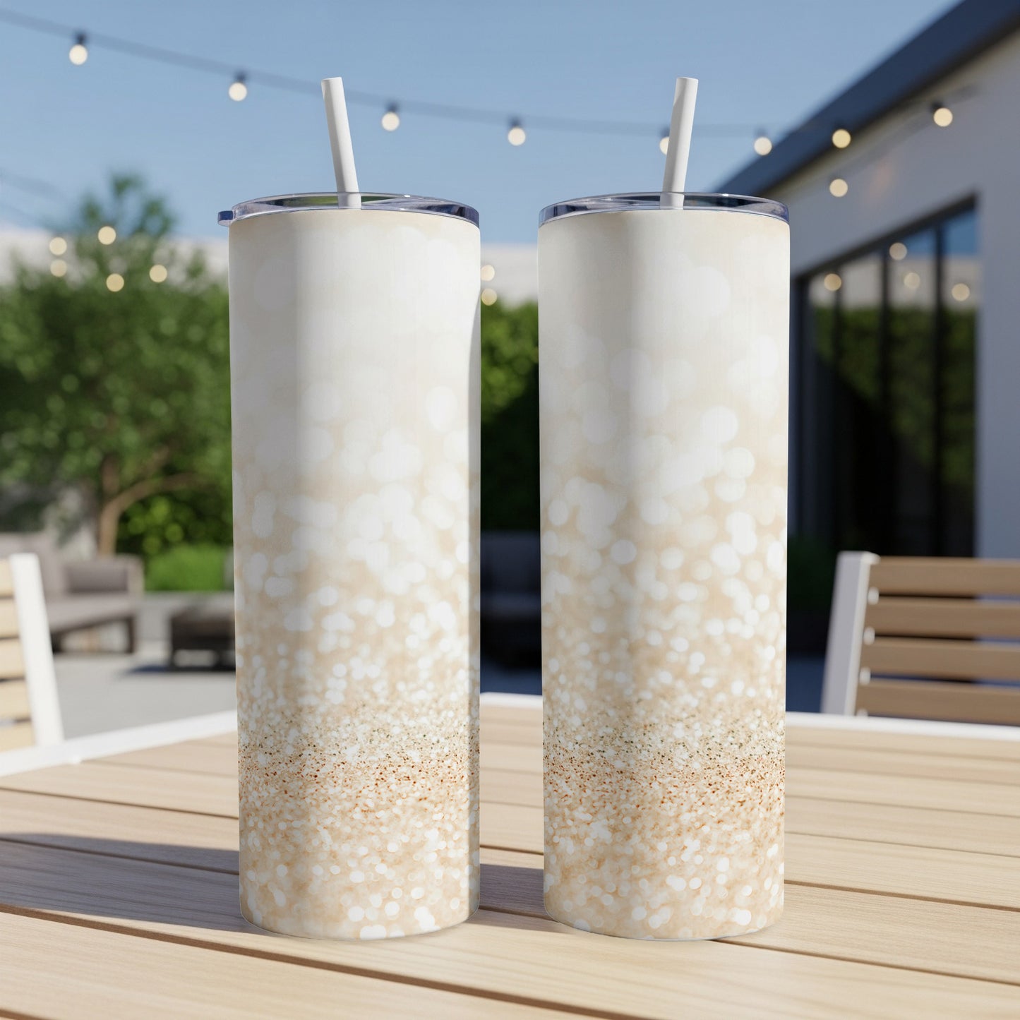 Two tall, slim tumblers with a sparkly gold and white gradient pattern.