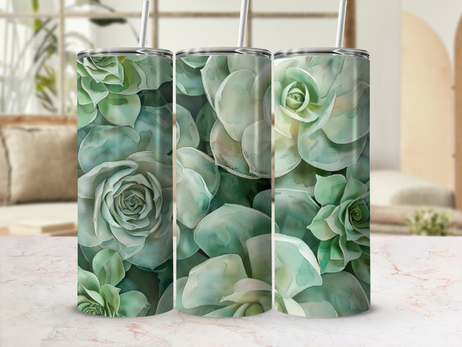 Three tumblers with a watercolor succulent floral pattern.