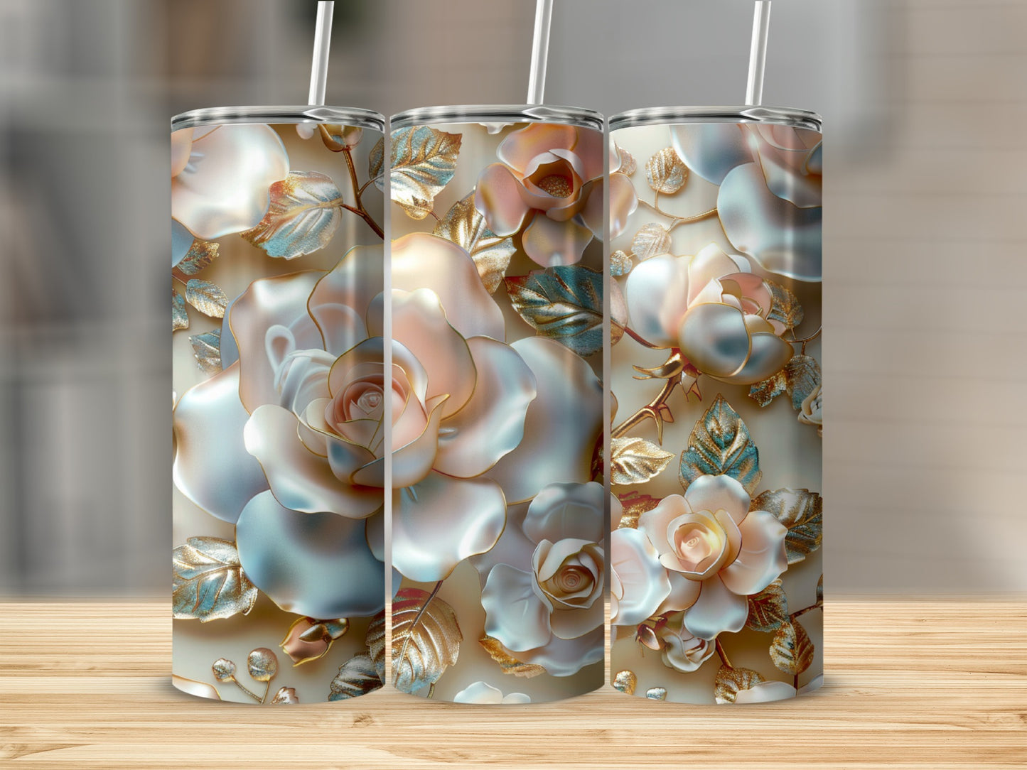 Three tall tumblers with rose and leaf floral design in muted tones.