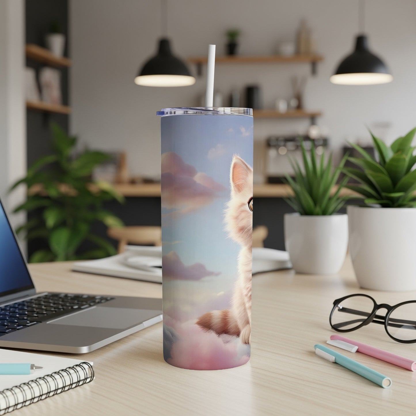 Tall tumbler featuring a fluffy kitten amongst pink and blue clouds.