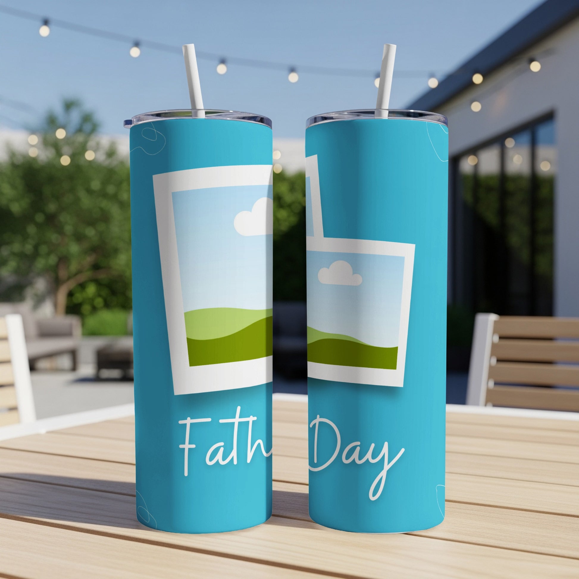 Two blue tumblers with "Father Day" text and framed landscape graphics.