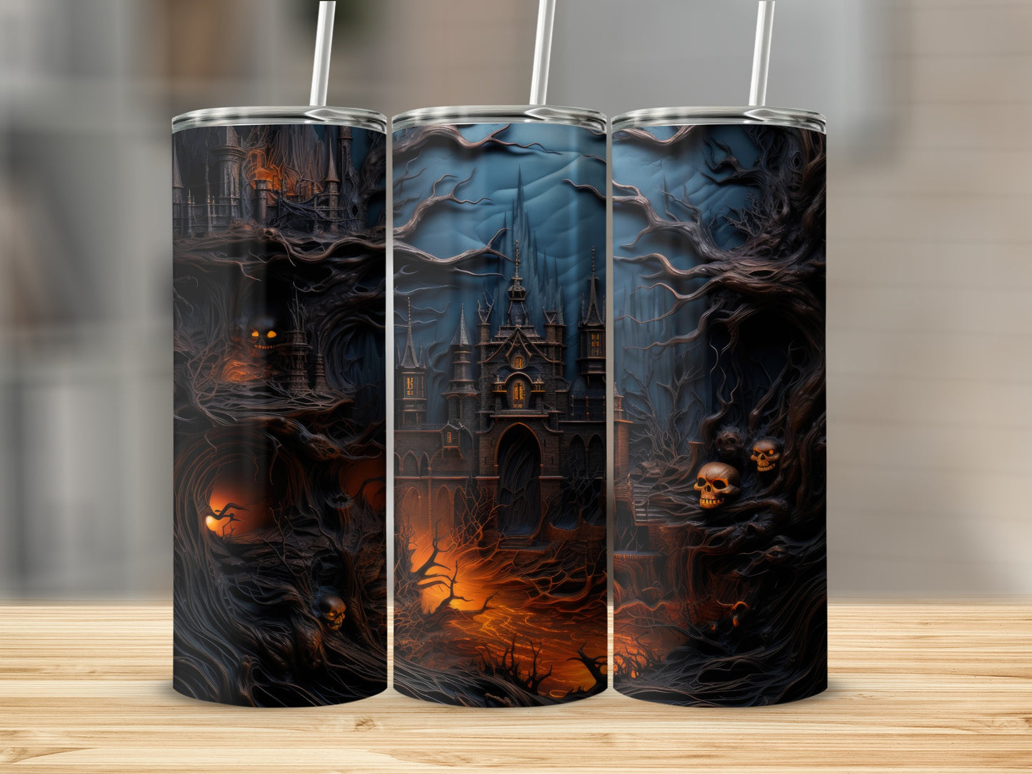Tumblers with a dark fantasy castle, spooky trees, and skulls on a wooden surface.