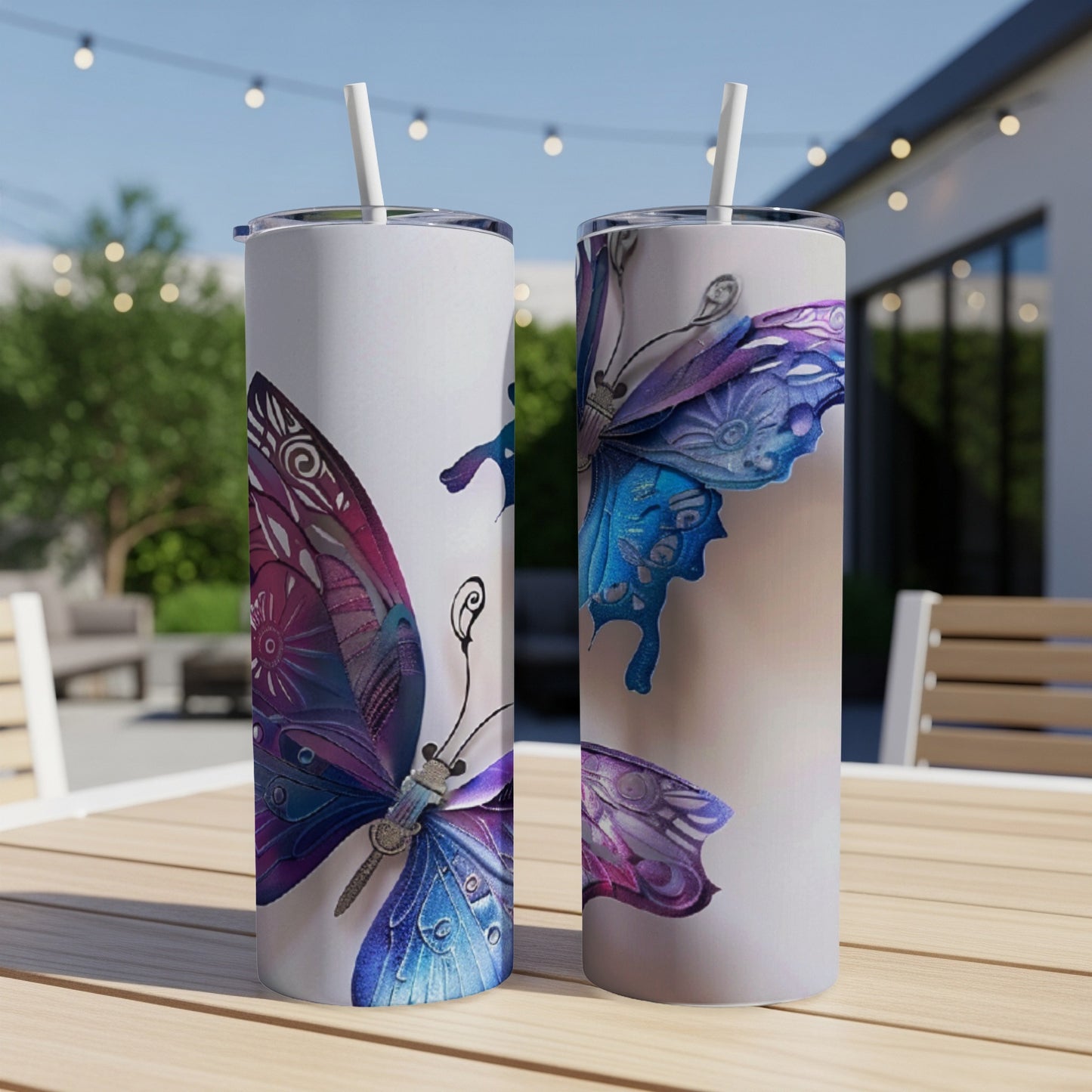 Two tumblers with ornate purple and blue butterfly designs.