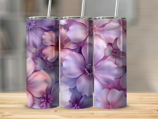 Three tumblers with a purple and pink floral pattern sit on a wooden surface.