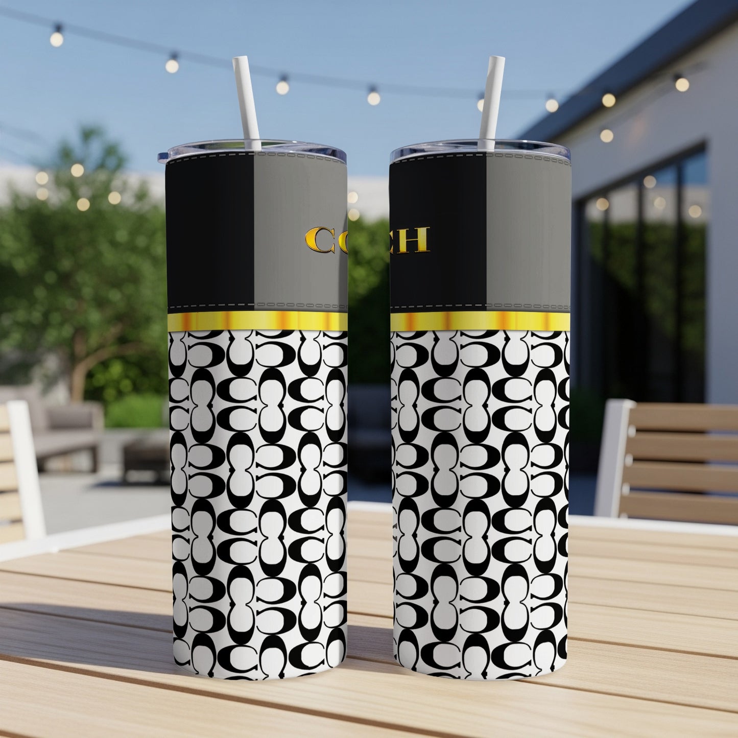 Two tumblers with repeated 'C' logo pattern and gold 'COACH' text.