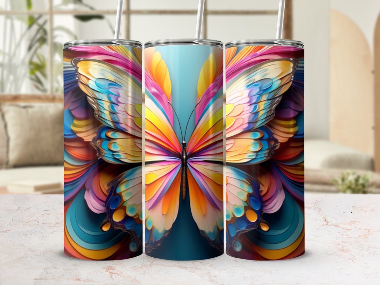 Three tall tumblers with a colorful abstract butterfly wing design.