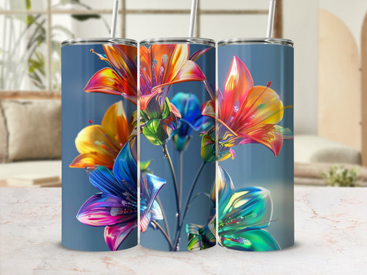 Three tall tumblers adorned with vibrant, colorful floral designs.