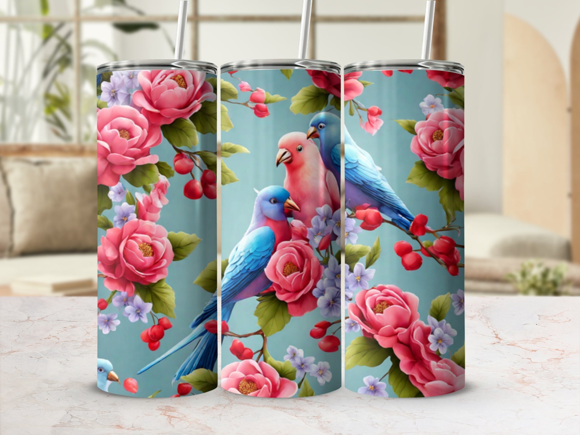 Two blue and one pink parakeet perched on a branch with pink roses.