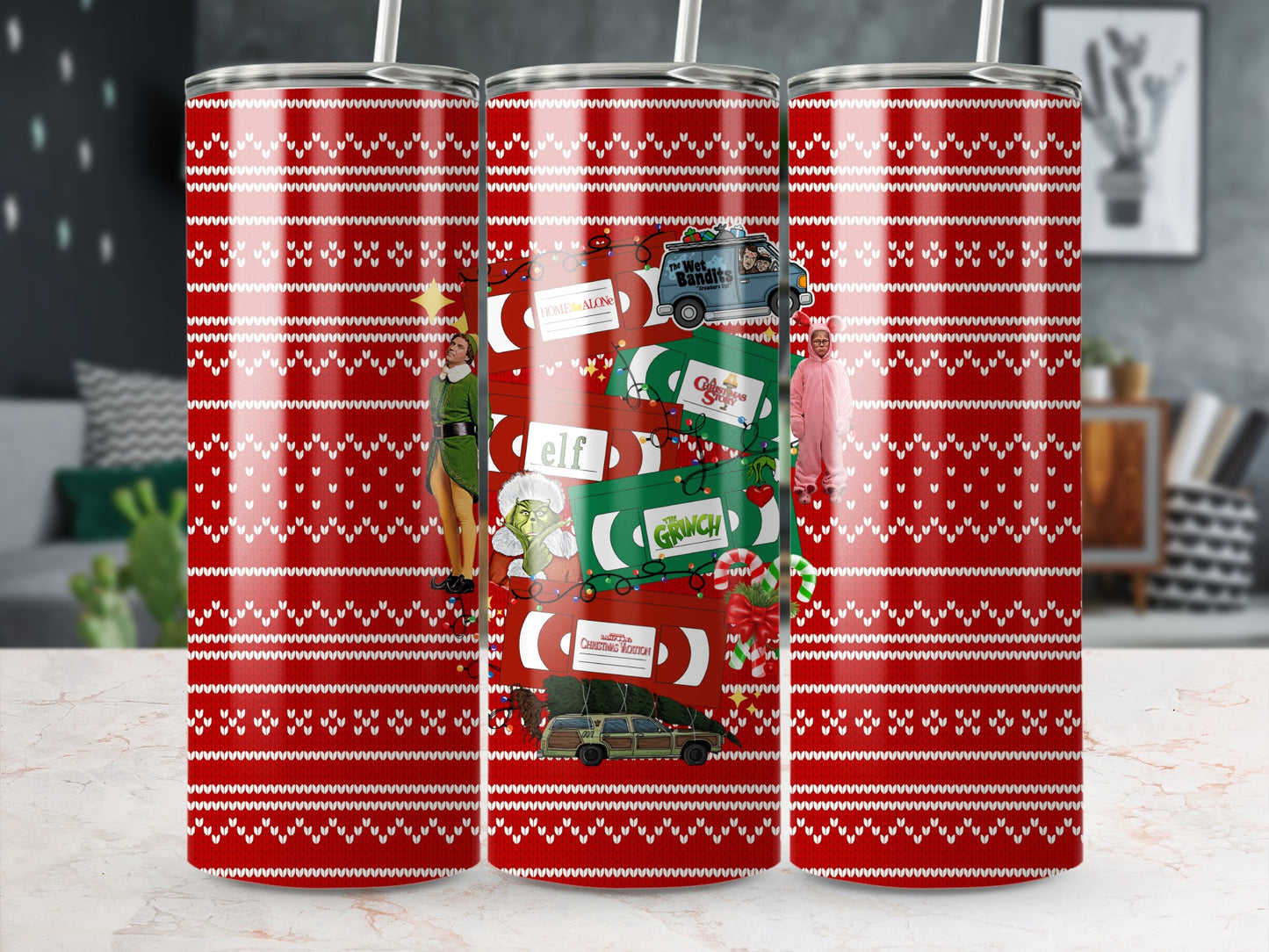 Red tumbler with classic Christmas movie characters and scenes on a white sweater pattern.