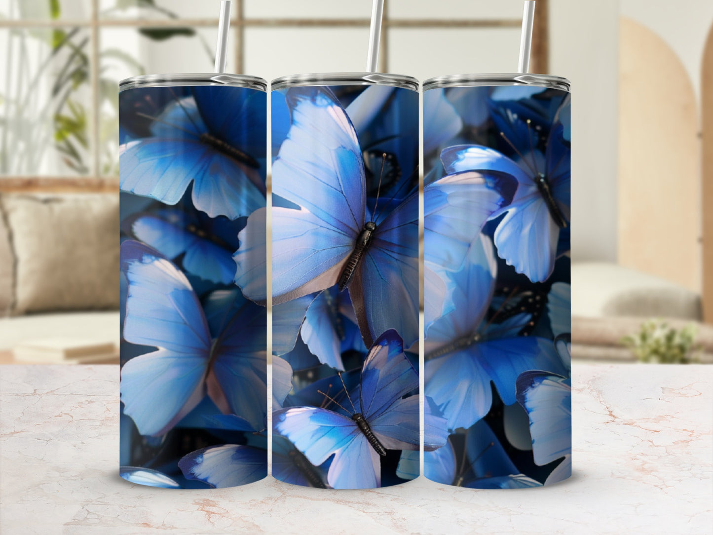 Three tumblers with a close-up blue butterfly design.
