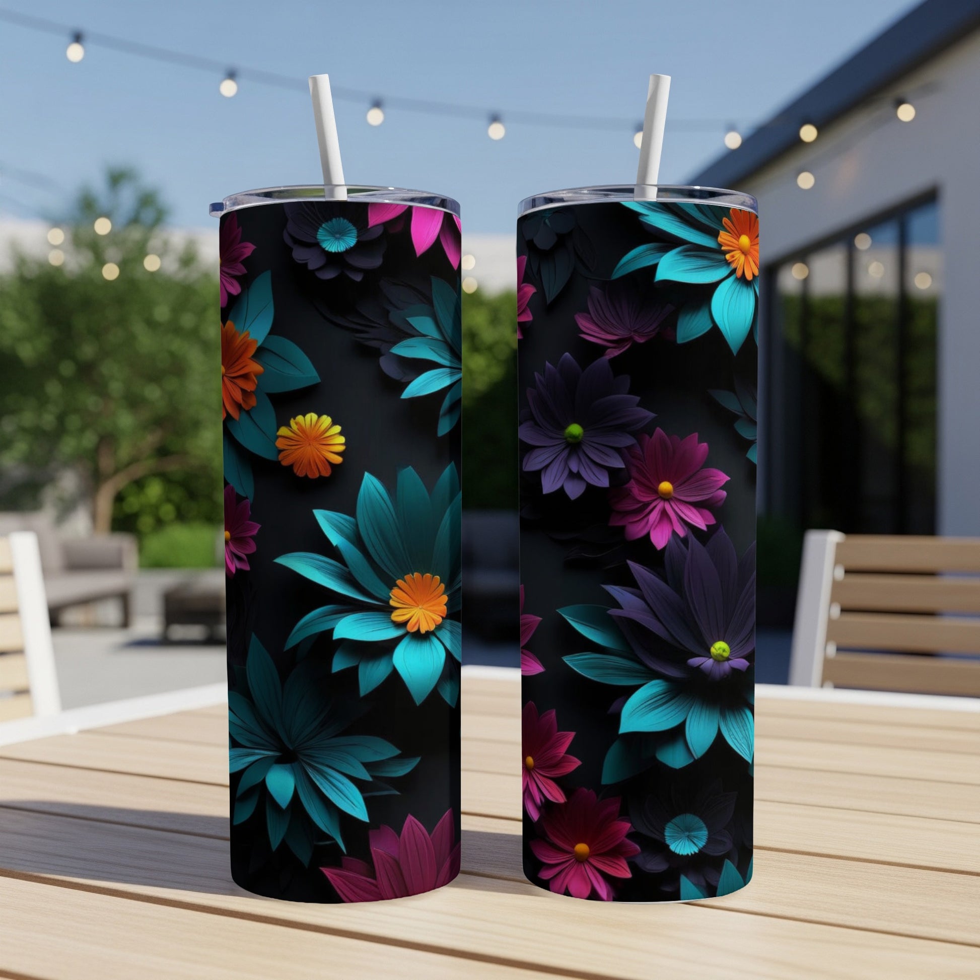Two tumblers with a dark floral pattern featuring teal, pink, and purple flowers.