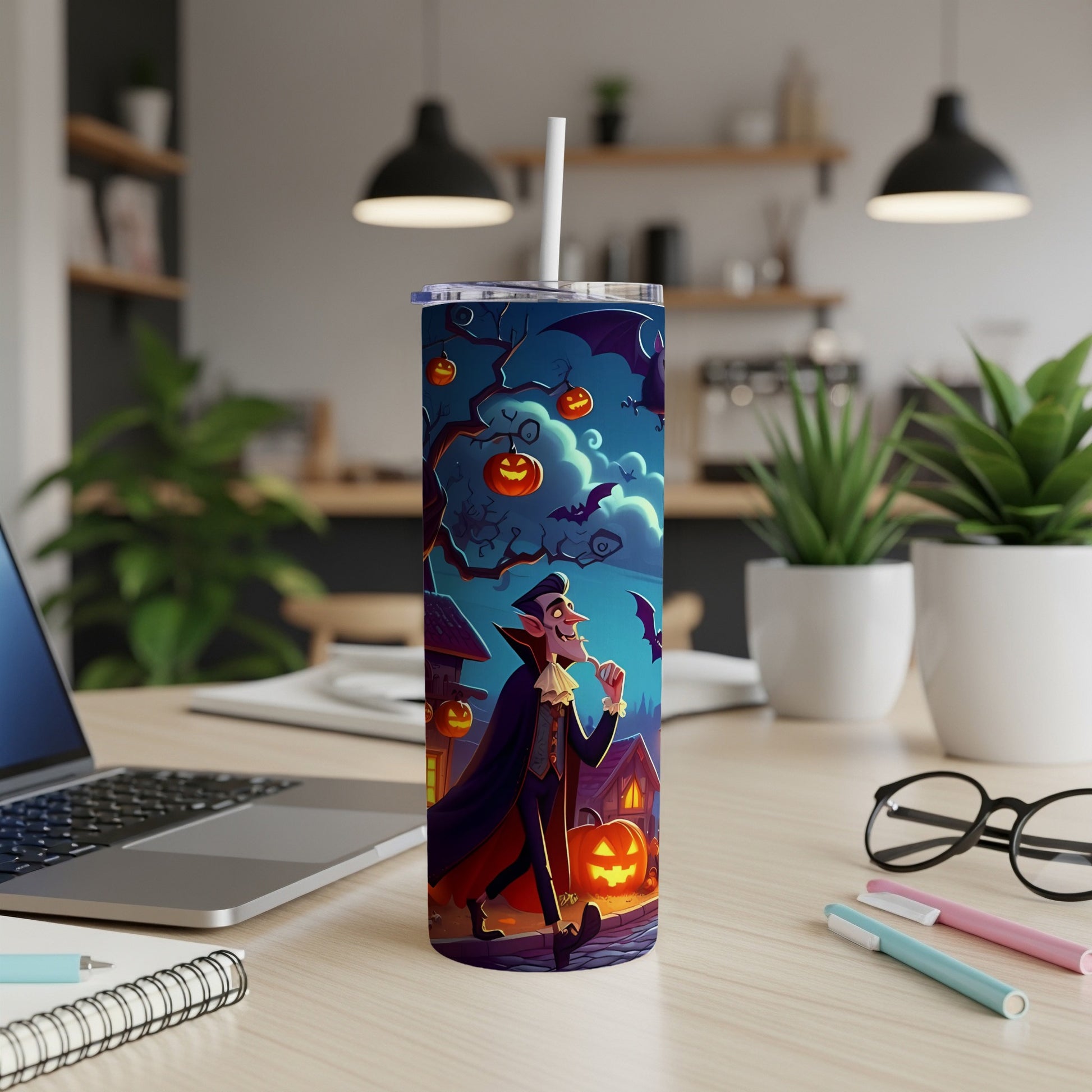 Tall tumbler with a Halloween design featuring a cartoon vampire and pumpkins.