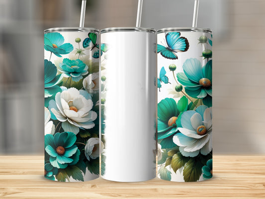 Two teal and white floral tumblers with butterflies on a wooden surface.