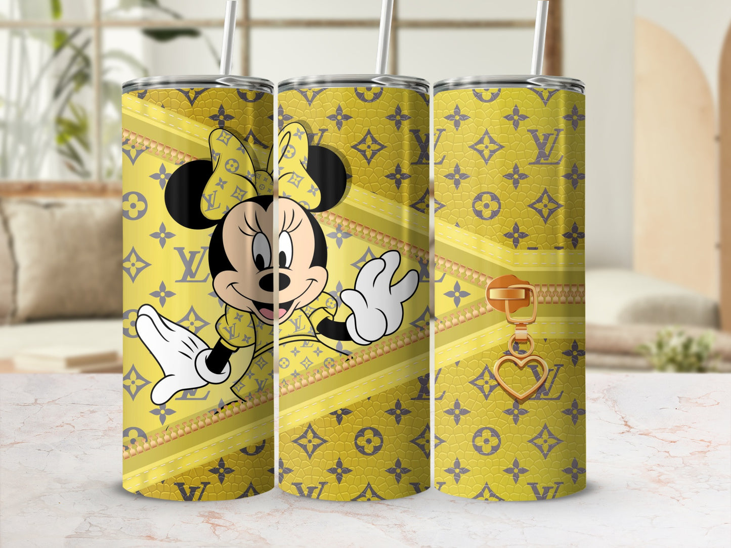 Minnie Mouse on a yellow tumbler with LV-inspired pattern and gold zipper charm.