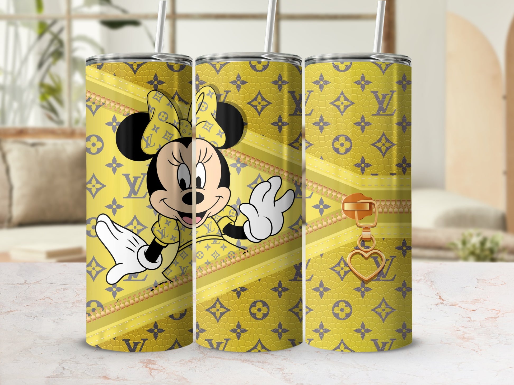 Minnie Mouse on a yellow tumbler with LV-inspired pattern and gold zipper charm.