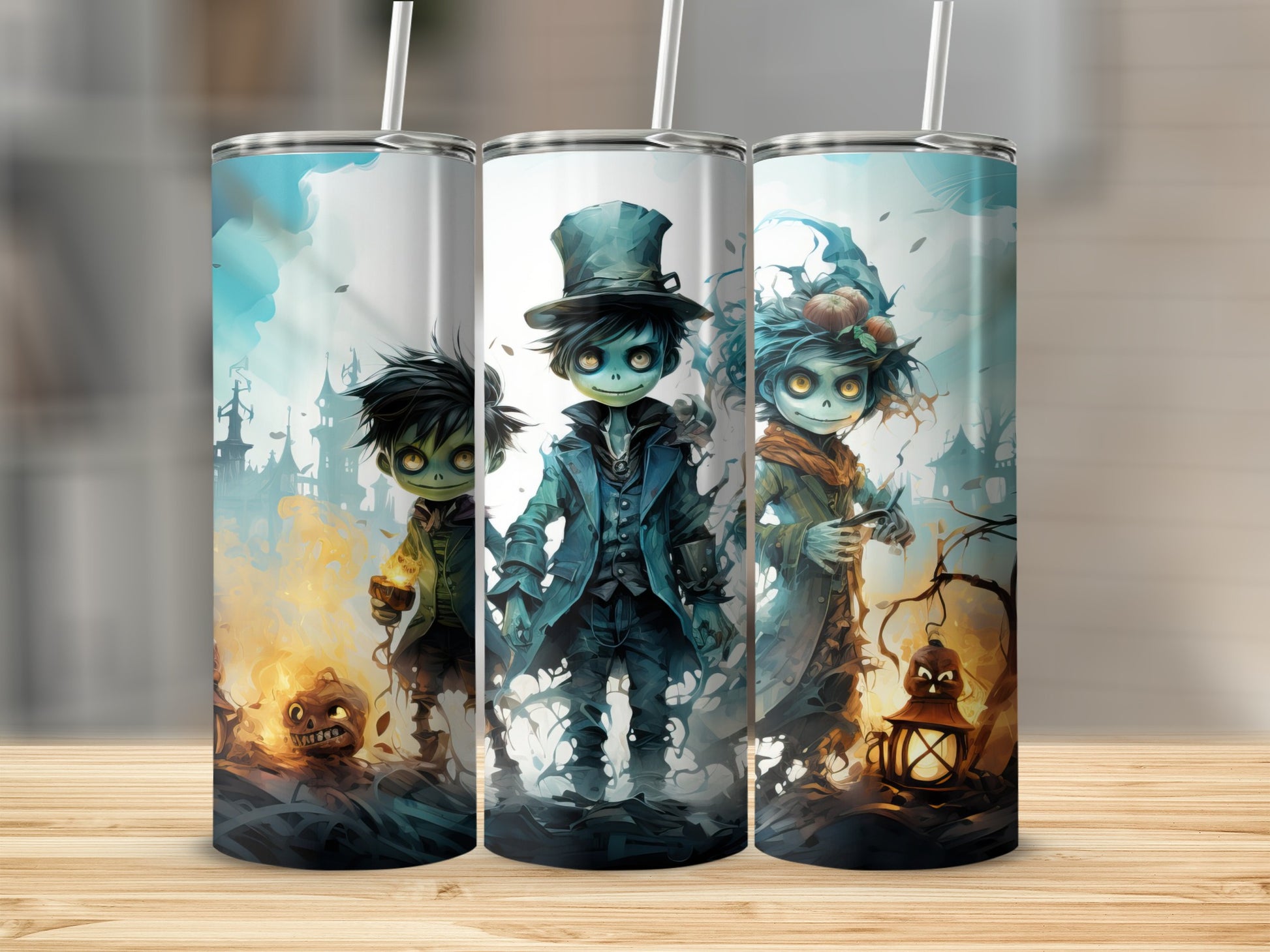 Three Halloween-themed tumblers featuring cartoon monsters and spooky gothic-style elements.