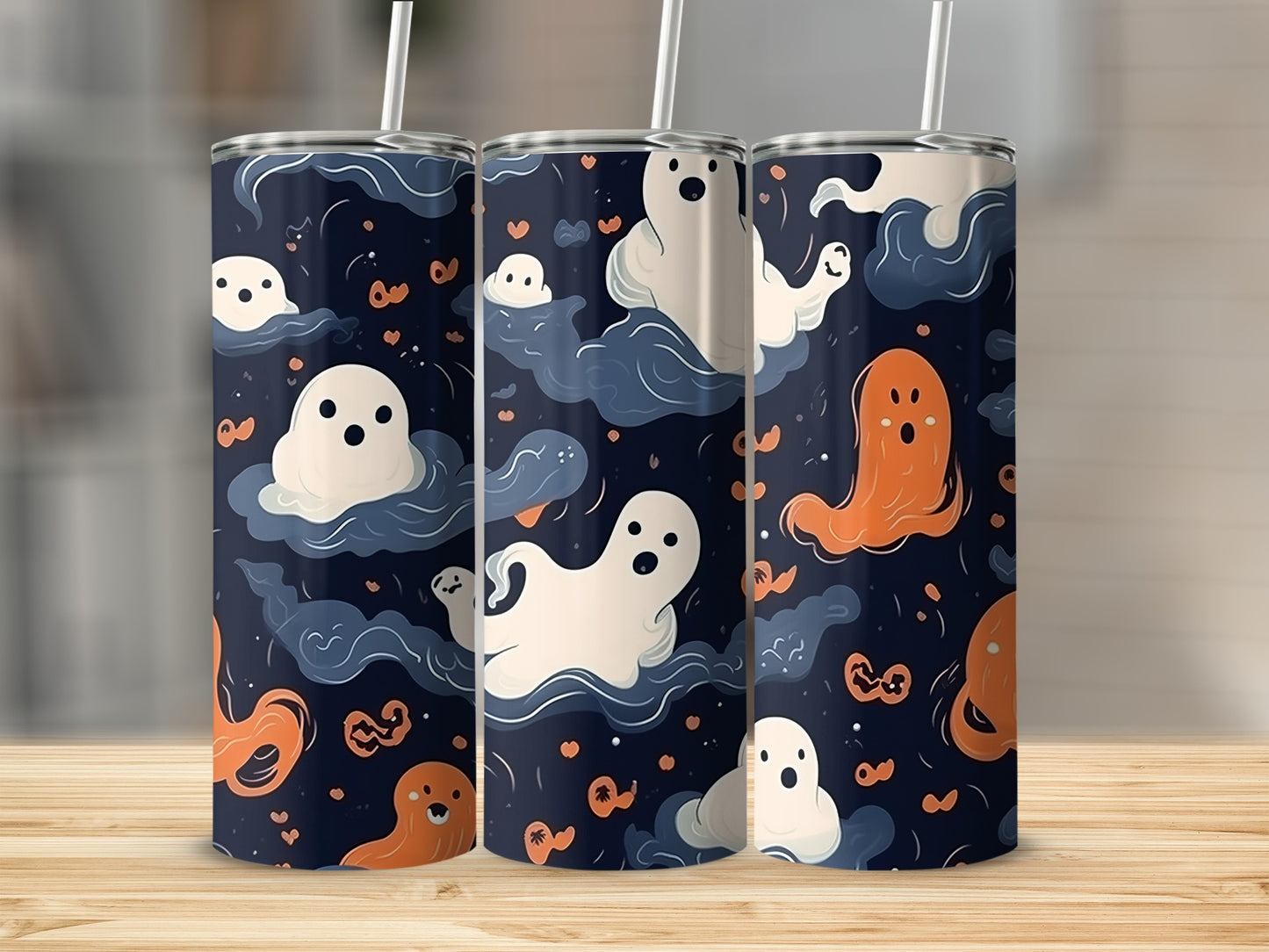 Tumblers with a dark blue Halloween pattern featuring white and orange ghosts.