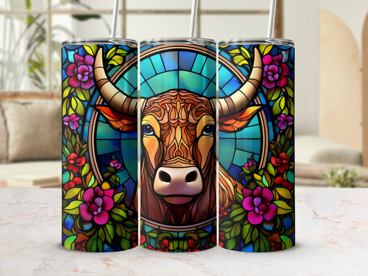 Stained glass bull with floral border on a tumbler.