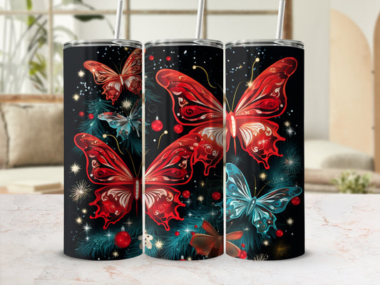 Three tumblers with red and blue butterflies and Christmas ornaments.