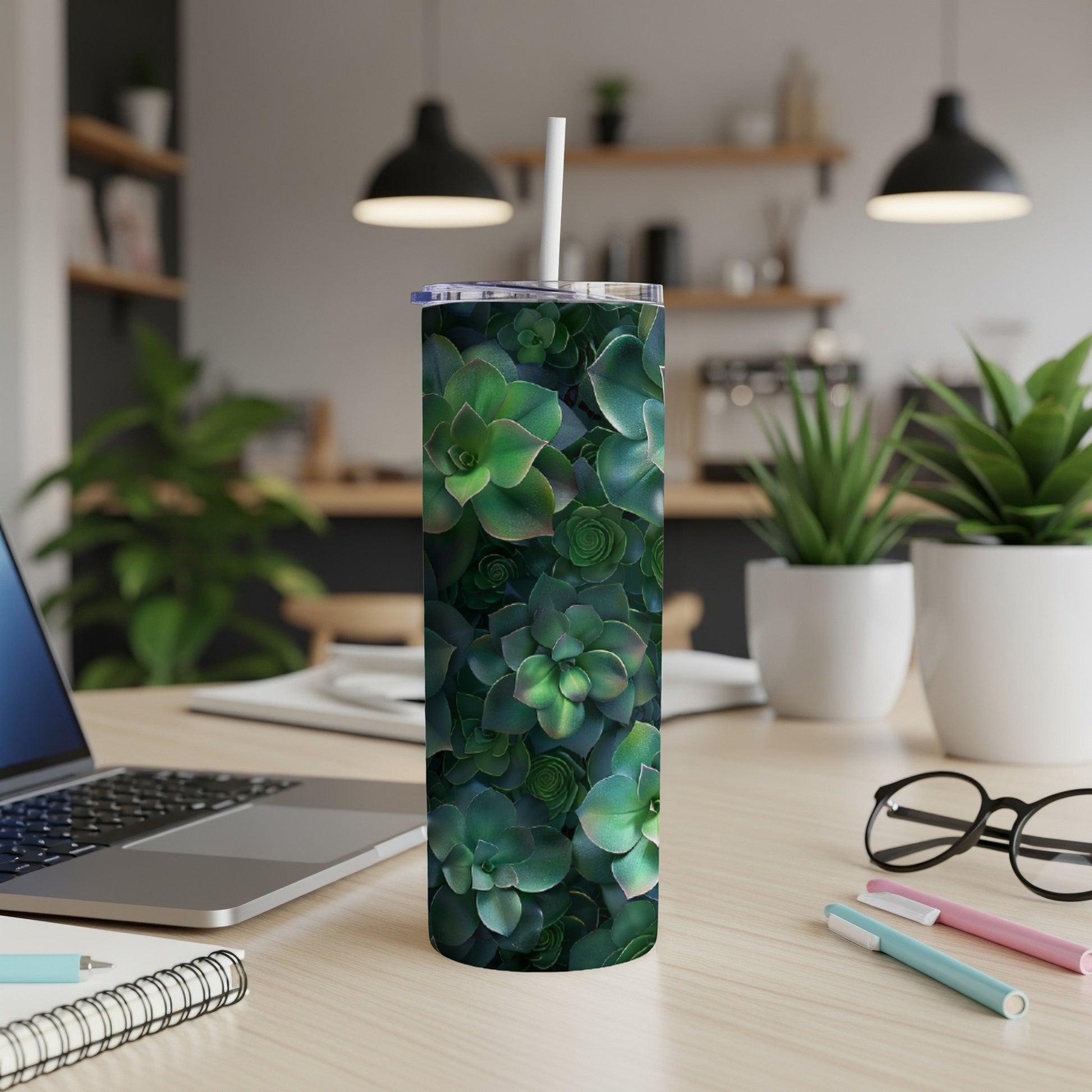 Green succulent plants pattern on a white tumbler with a straw.
