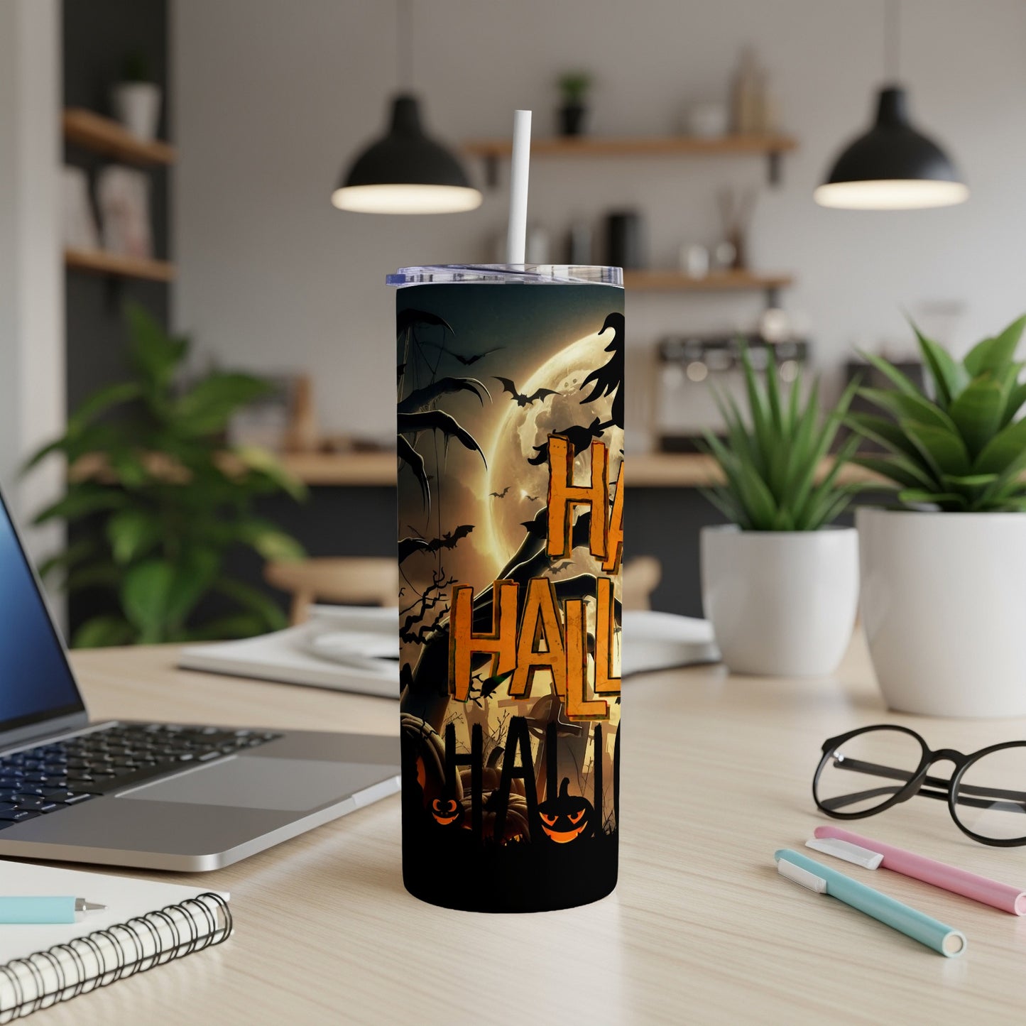 Tall tumbler with Halloween design featuring pumpkins, bats, and "Happy Halloween" text.