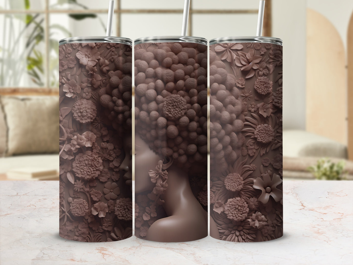 Brown tumbler with intricate floral relief and woman's silhouette.