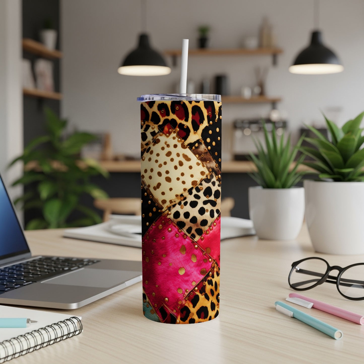 Tumbler with leopard print, pink, and polka dot sections.