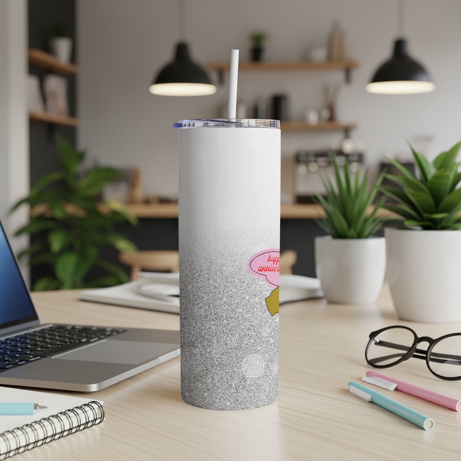Silver glitter tumbler with cartoon character and "Happy Anniversary" text.