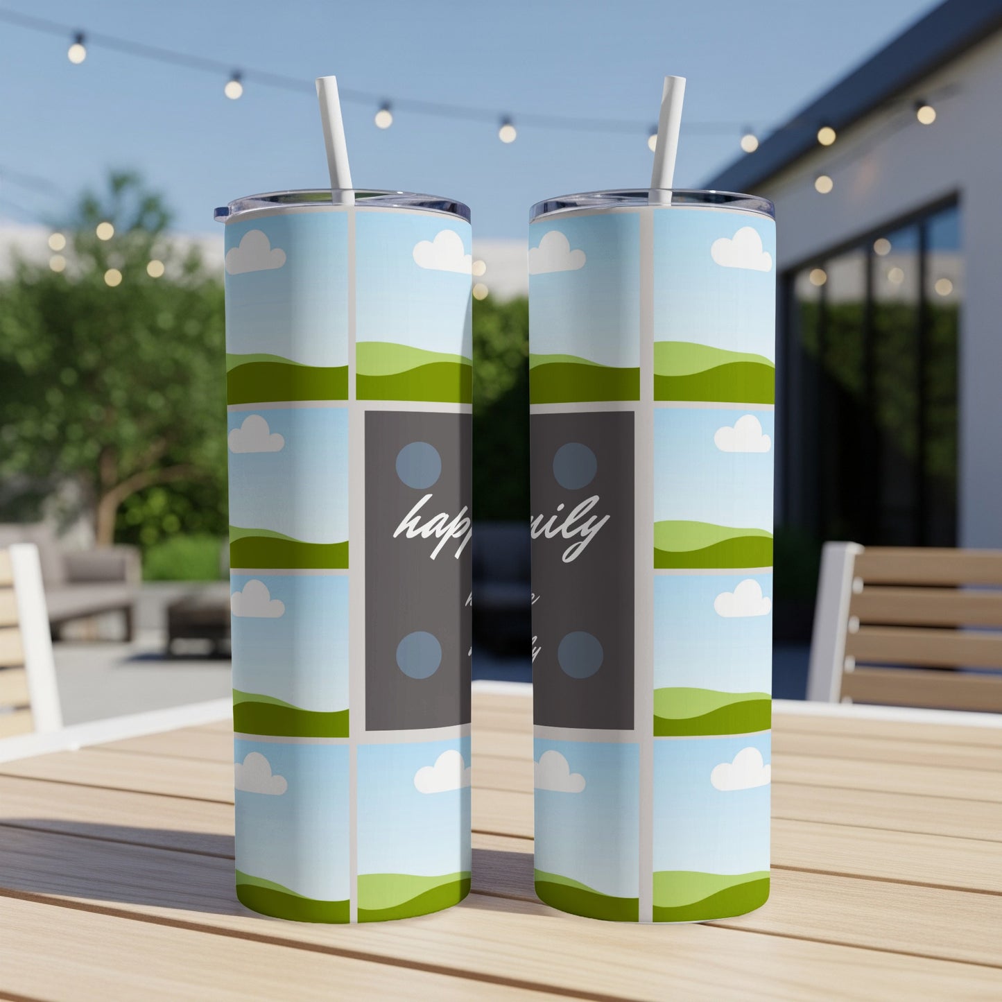 Two tumblers with a "happily" design and a sky and rolling hills pattern.