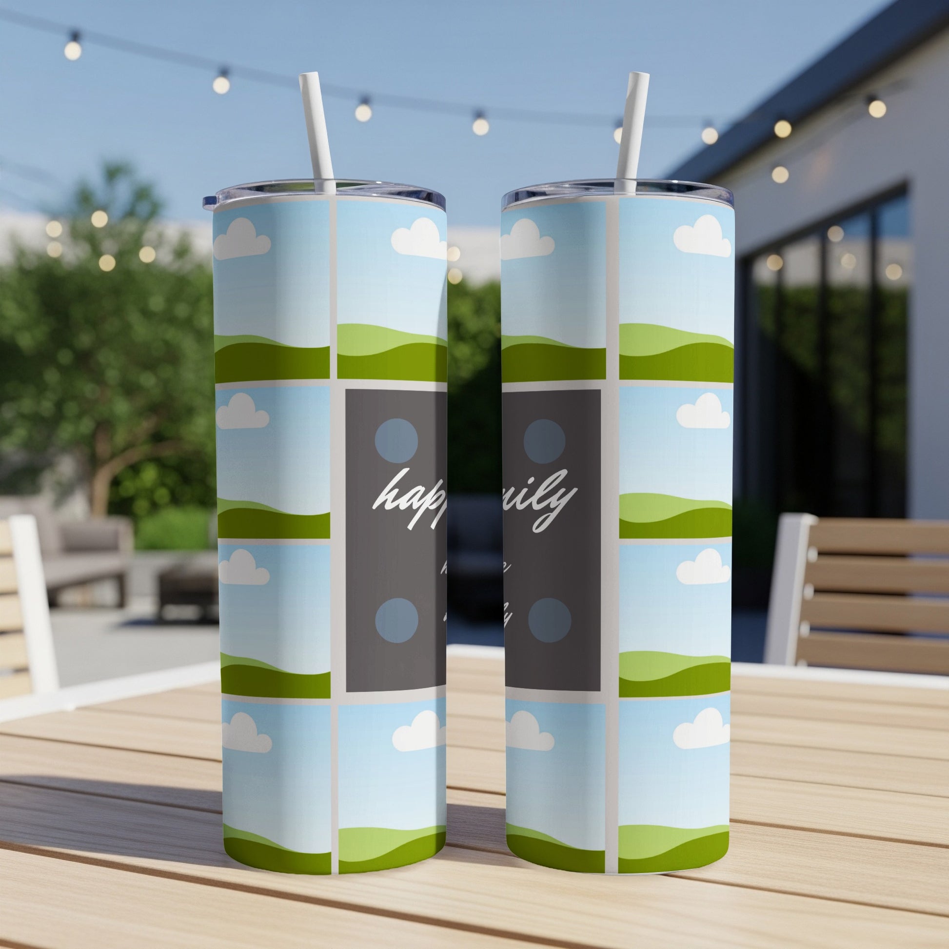 Two tumblers with a "happily" design and a sky and rolling hills pattern.