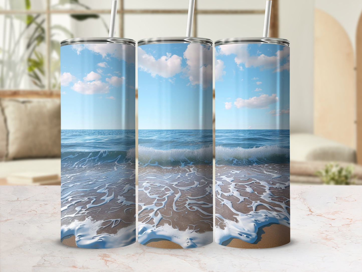 Three tumblers with a beach wave scene wrap around them.