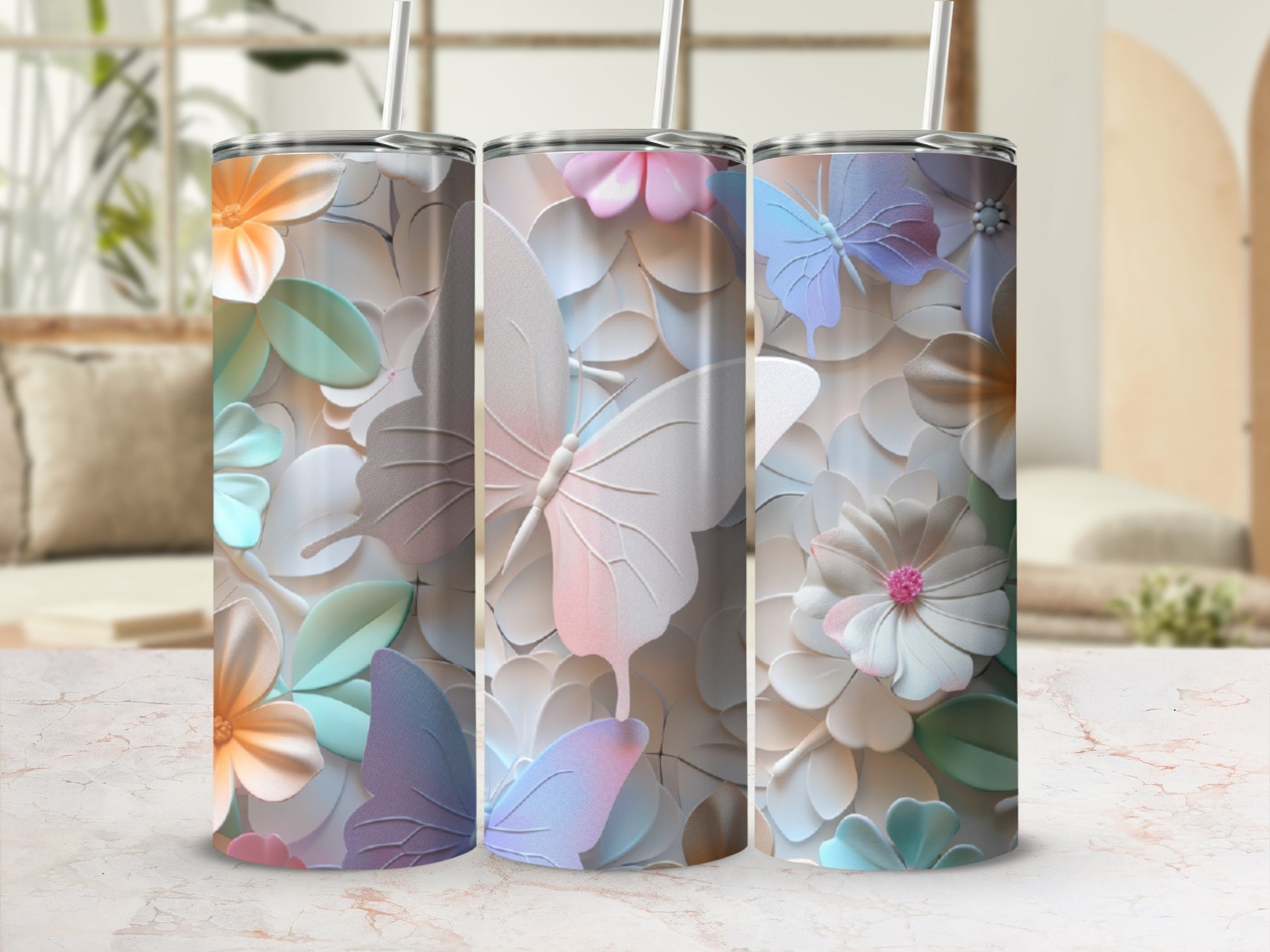 Three tumblers with pastel floral and butterfly designs.
