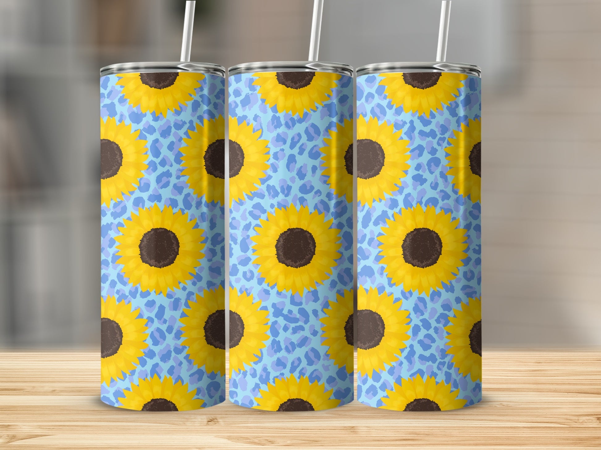 Three tumblers featuring a blue leopard print background with yellow sunflowers.