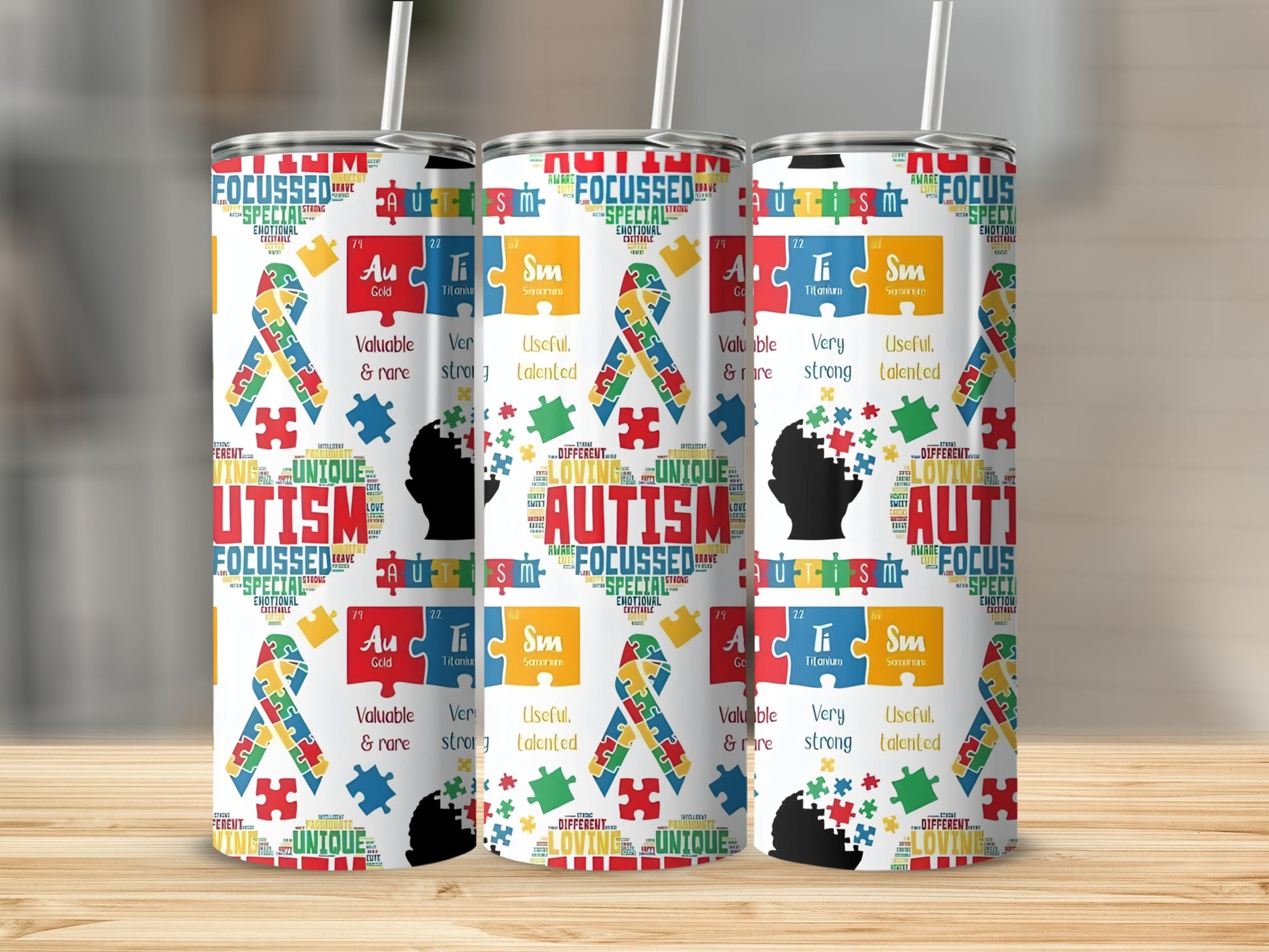 Tumbling cups with autism awareness puzzle piece pattern and text.