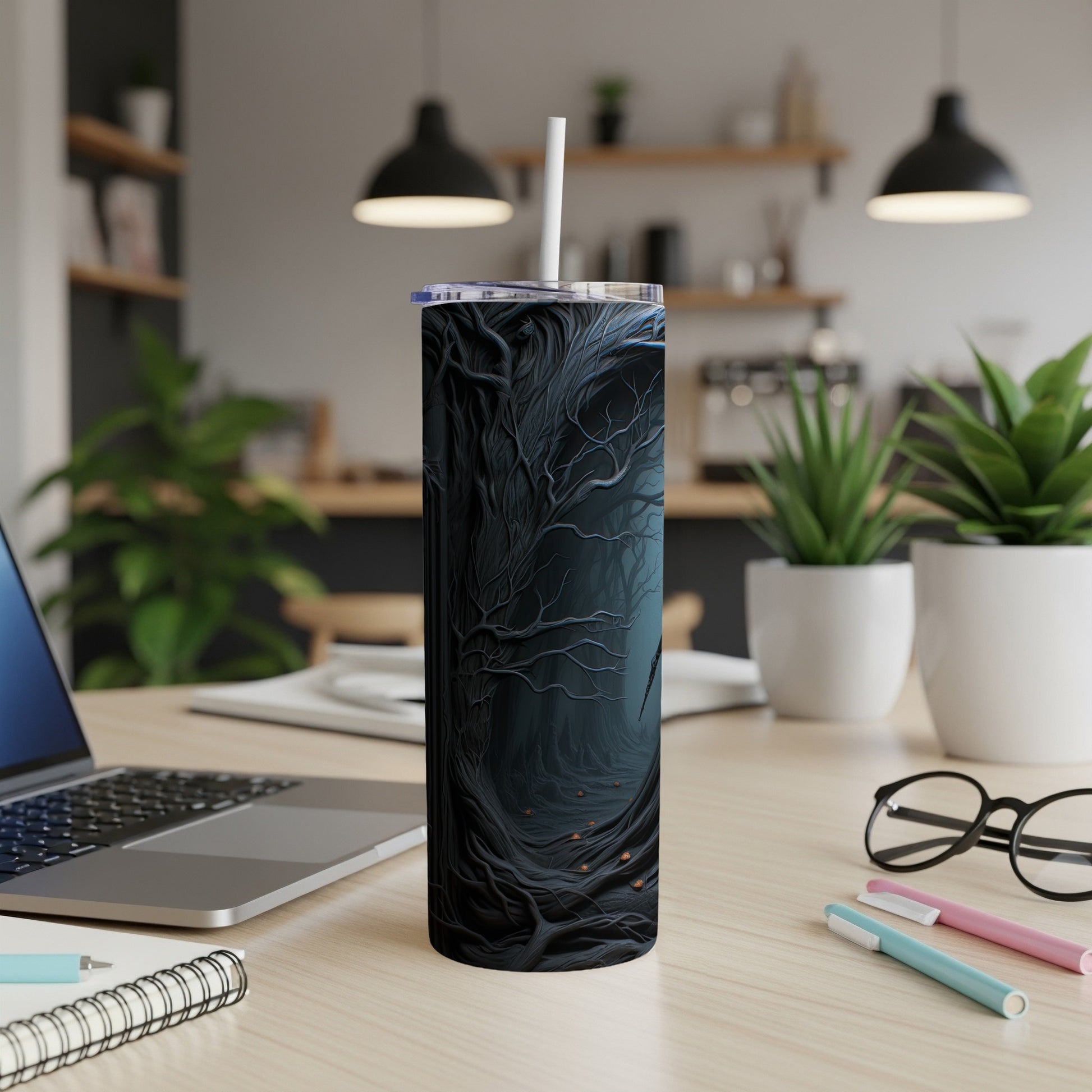 Tumbler with dark, gnarled tree forest design and white straw.