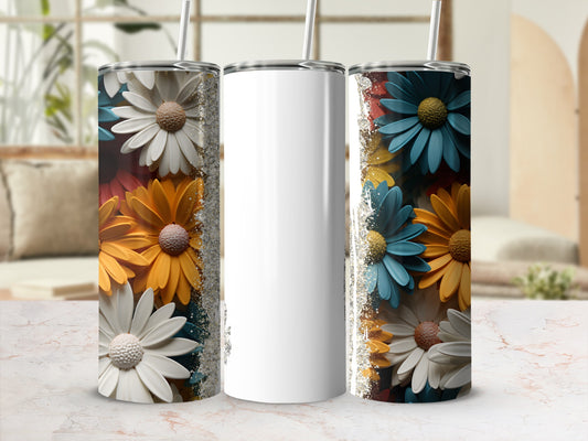 Three floral tumblers with white, orange, yellow, and blue petals against a blurred background.