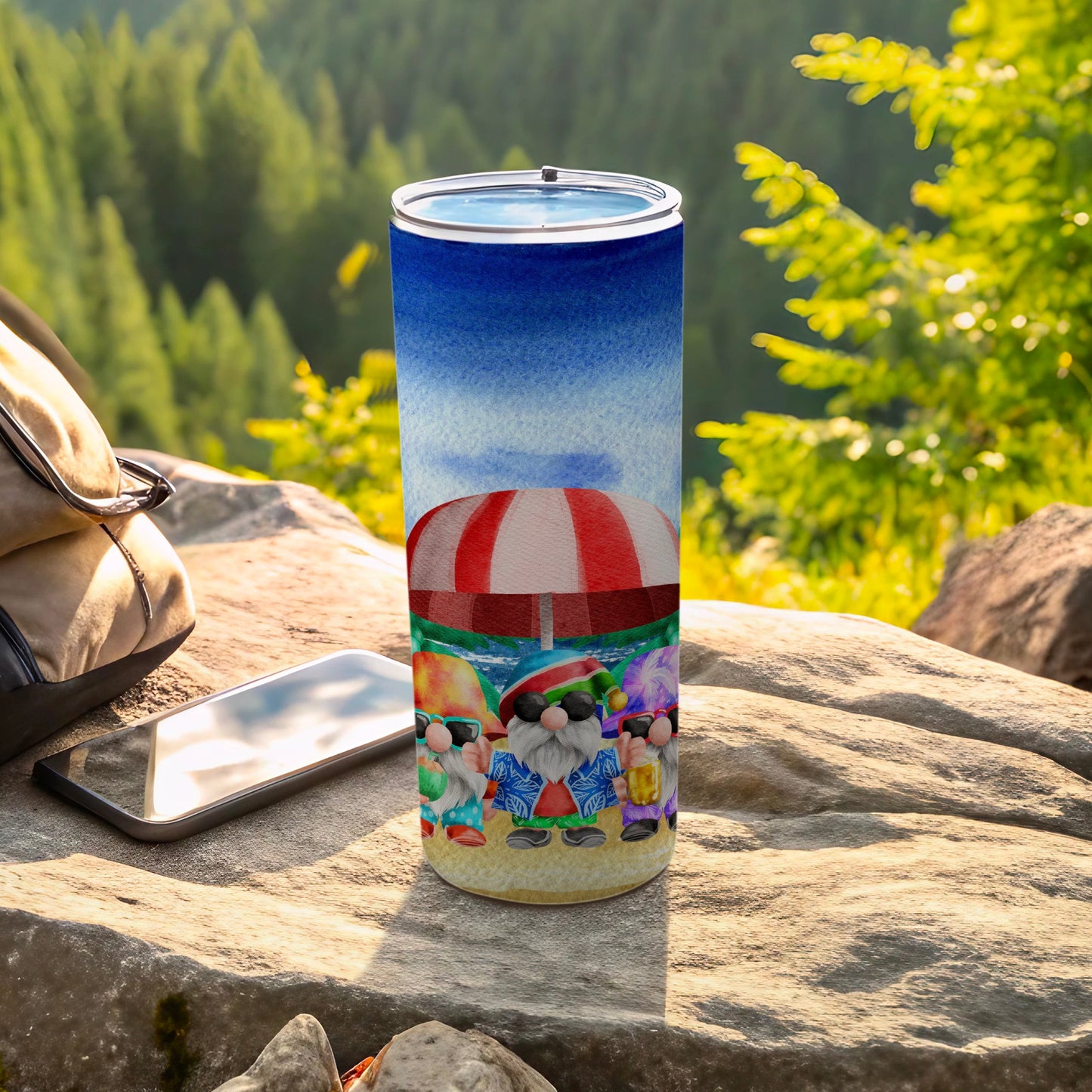 Beach-themed tumbler with gnomes under a striped umbrella.