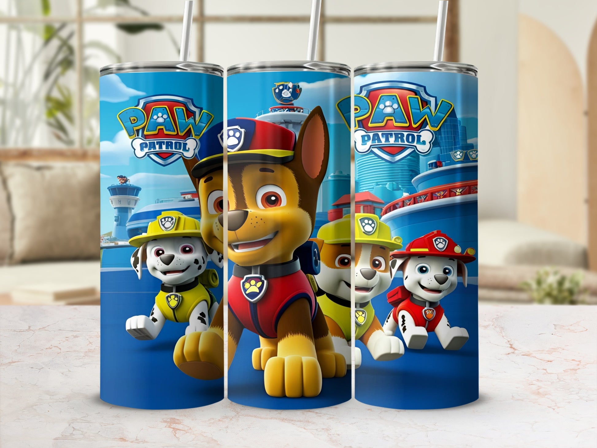 Paw Patrol characters Chase, Marshall, and Rubble on a blue tumbler.