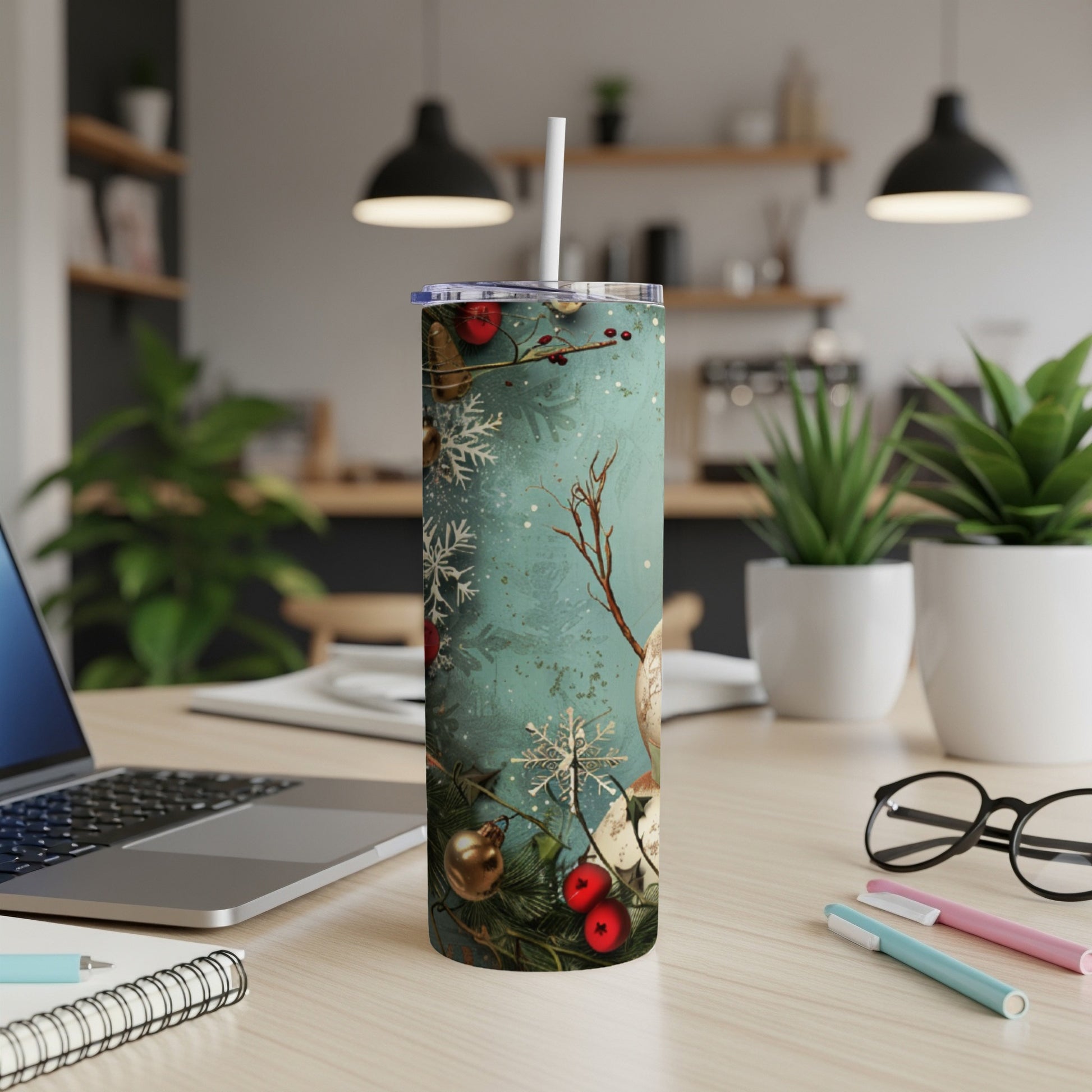 Tall skinny tumbler with Christmas snowflake and holly design.